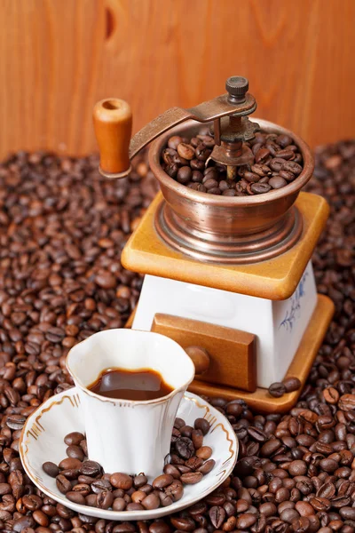 Cup of coffee and roasted beans — Stock Photo, Image