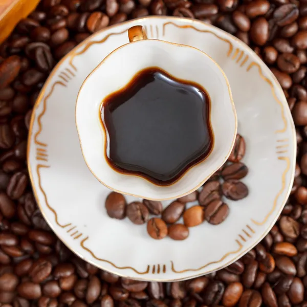 Taza de café y frijoles asados — Foto de Stock