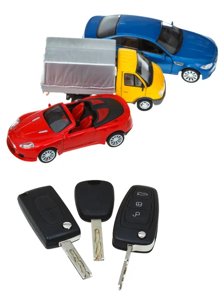 Three vehicle keys and model cars — Stock Photo, Image