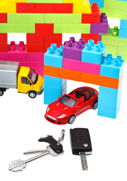 Keys, model car, plastic block house — Stock Photo, Image