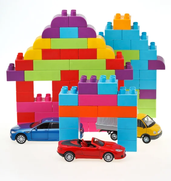 Modelo de carro, bloco de plástico casa — Fotografia de Stock