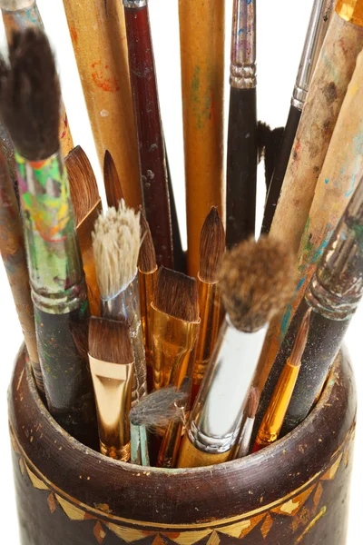 Used artistic paintbrushes in wooden cup closed up — Stock Photo, Image