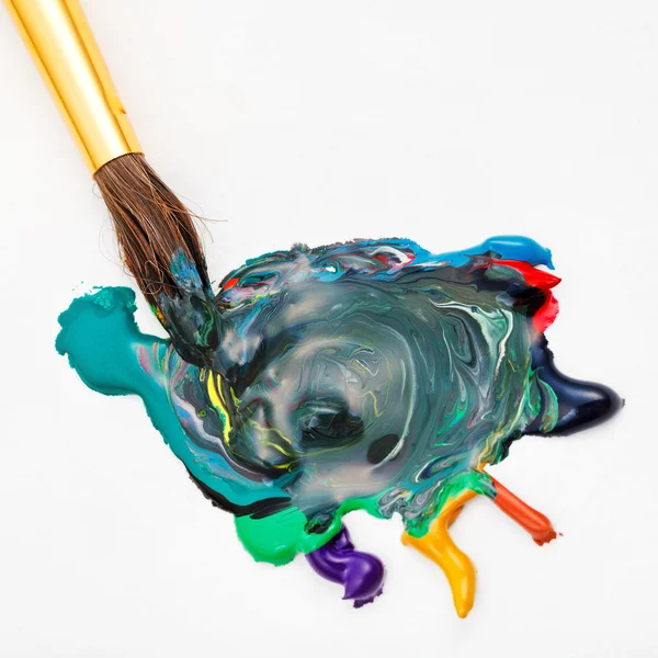 Paintbrush blends multicolored watercolors — Stock Photo, Image