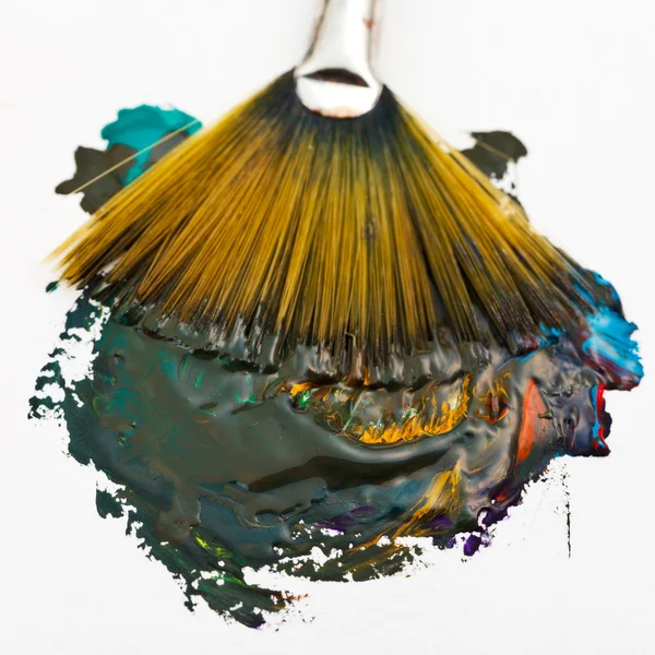 Fan paintbrush blends multicolored watercolors — Stock Photo, Image