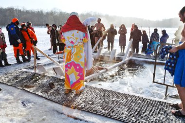ice swimming in Epiphany Day clipart