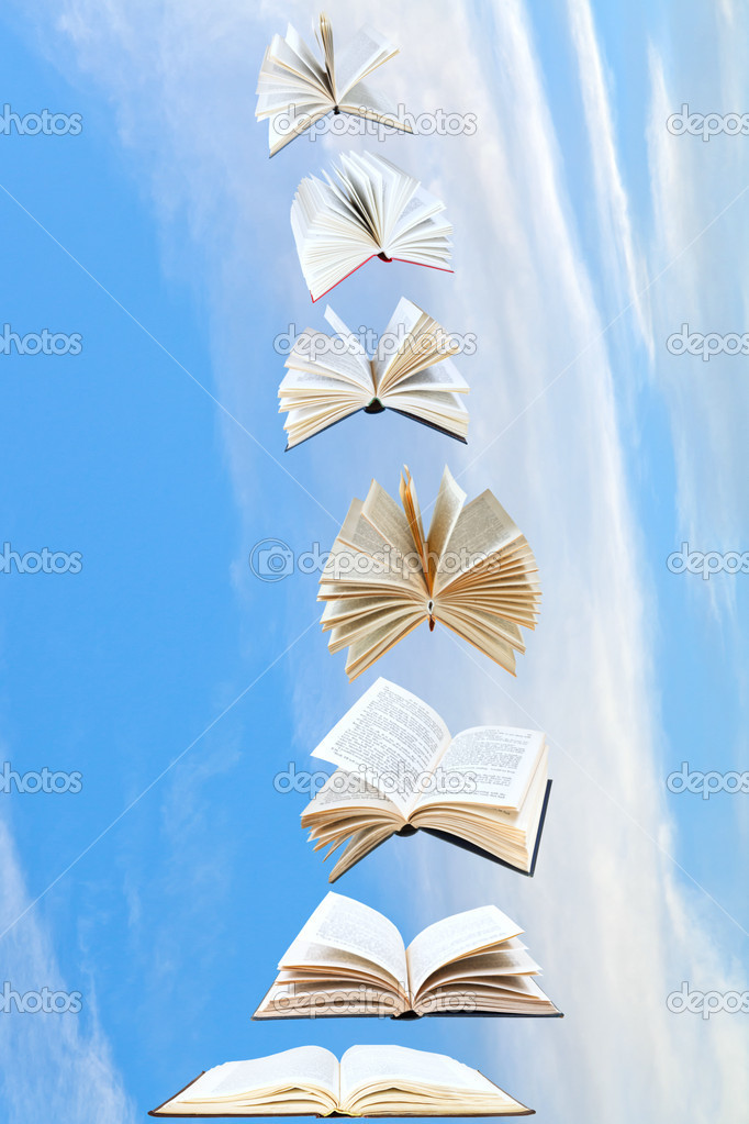 stack of books fly in blue sky