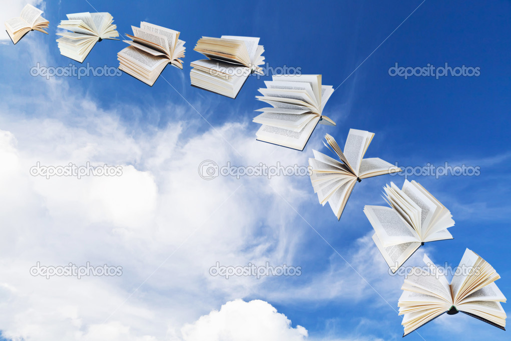 arch of flying books with blue sky