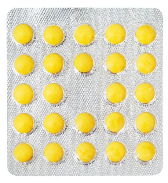 Żółty tabletek w blistrze na białym tle — Zdjęcie stockowe