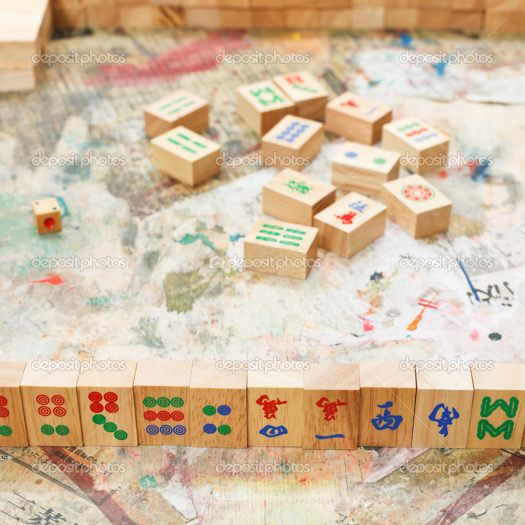 wood tiles on player hand in mahjong game