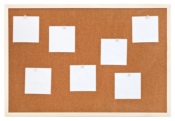 Several sheets of paper on bulletin cork board — Stock Photo, Image