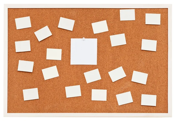 Small sheets of paper on bulletin cork board — Stock Photo, Image