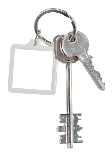 Two home keys and square keychain on ring — Stock Photo, Image