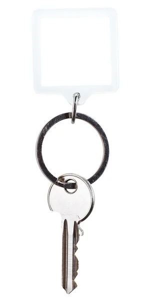 One steel key and square keychain on ring — Stock Photo, Image