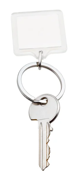 Jeden klucz do domu i kwadratowy breloczek na pierścień — Zdjęcie stockowe