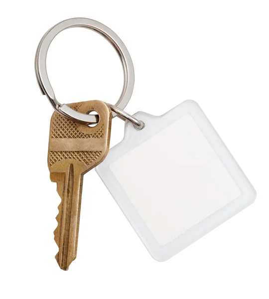 Home brass key and square keychain on ring — Stock Photo, Image