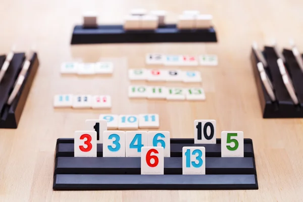 Playing in Rummikub card board game — Stock Photo, Image