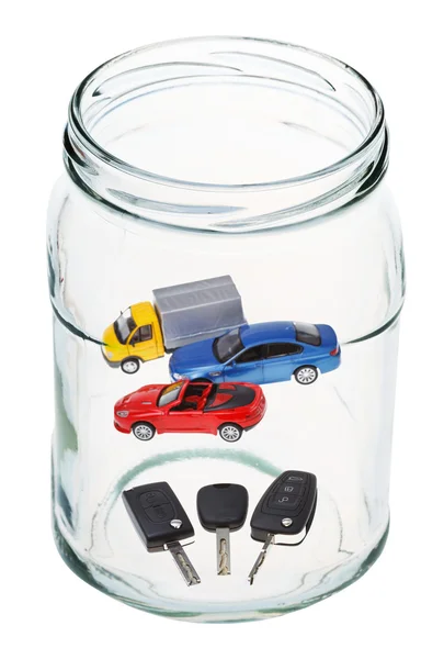 Carros e chaves em frasco de vidro aberto — Fotografia de Stock