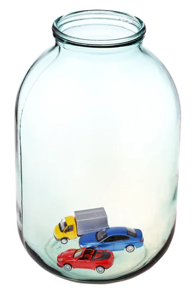 New cars in big open glass jar — Stock Photo, Image