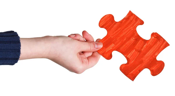 Female hand with painted red puzzle piece — Stock Photo, Image