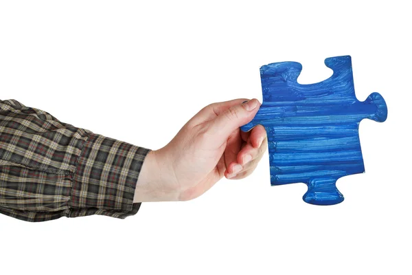 Male hand with painted blue puzzle piece — Stock Photo, Image