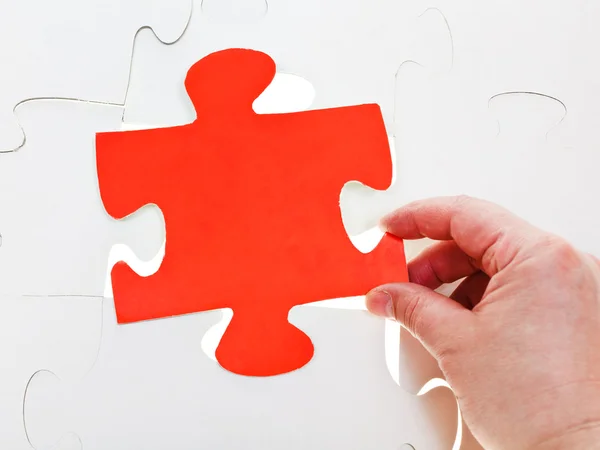 Fitting red puzzle piece on free space — Stock Photo, Image