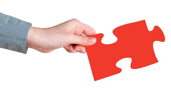 Female hand with red puzzle piece — Stock Photo, Image