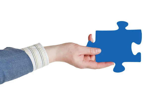 Male hand with blue puzzle piece — Stock Photo, Image