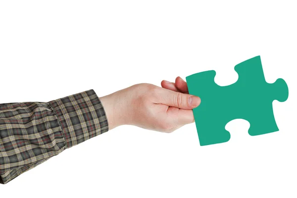 Male hand with green puzzle piece — Stock Photo, Image