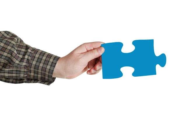 Male hand with blue puzzle piece — Stock Photo, Image