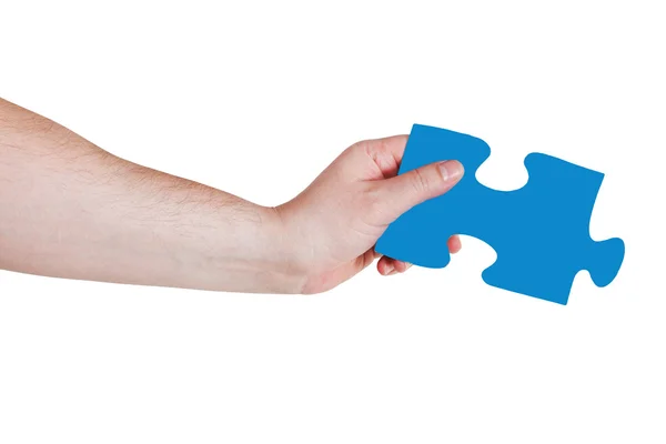 Male hand with blue puzzle piece — Stock Photo, Image