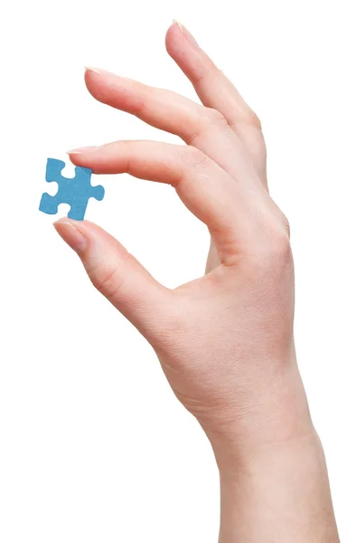 Female arm with puzzle piece — Stock Photo, Image