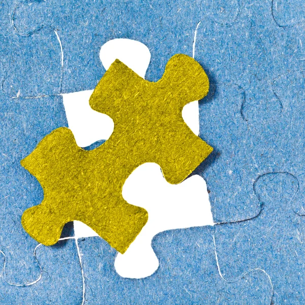 Setting the last yellow piece of puzzle — Stock Photo, Image