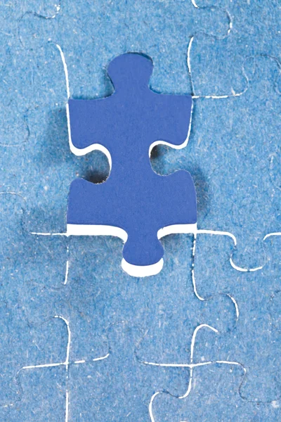 Setting the last blue piece of puzzle — Stock Photo, Image