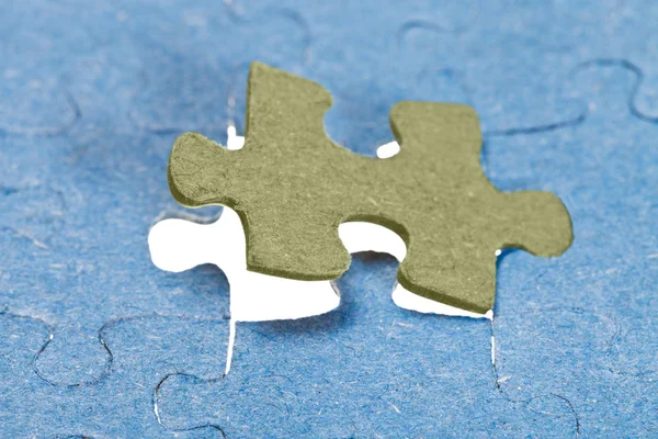 Fitting the last piece of puzzle — Stock Photo, Image