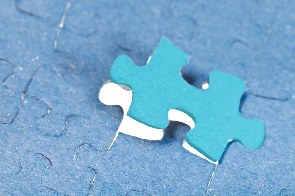 Setting the last new piece of puzzle — Stock Photo, Image