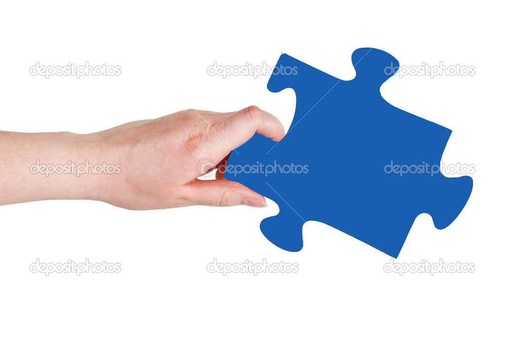 female hand with blue puzzle piece