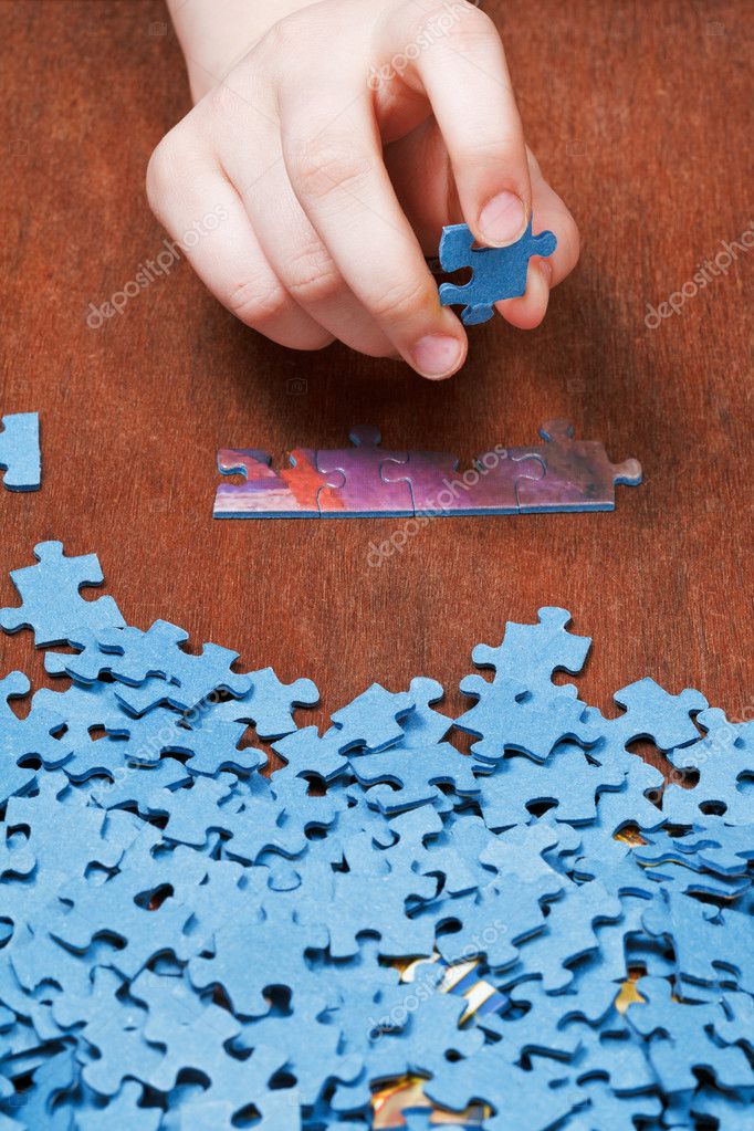 Choosing of jigsaw puzzles — Stock Photo © vvoennyy 44721391