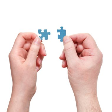 küçük puzzle parçaları ile erkek ve dişi el