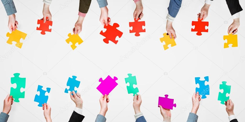 set different puzzle pieces in people hands