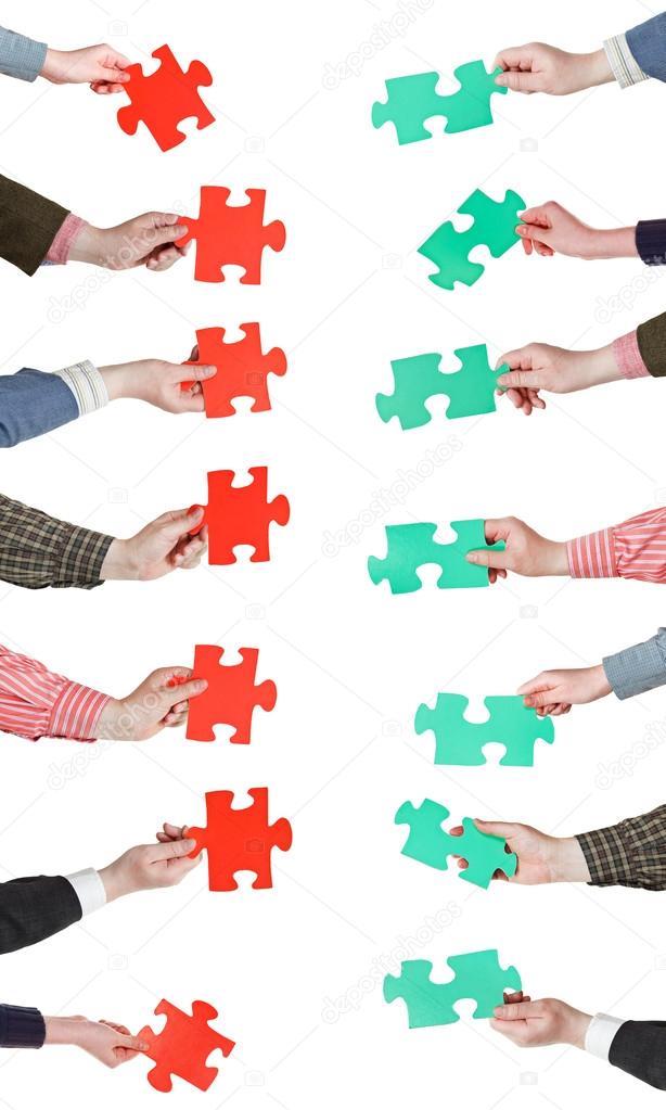 red and green puzzle pieces in people hands