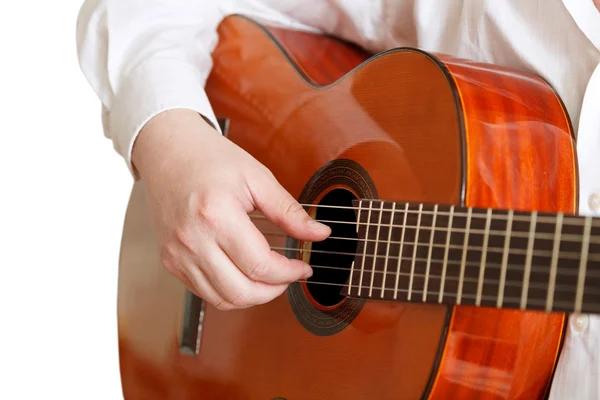 Man plays on typical acoustic guitar isolated Royalty Free Stock Images