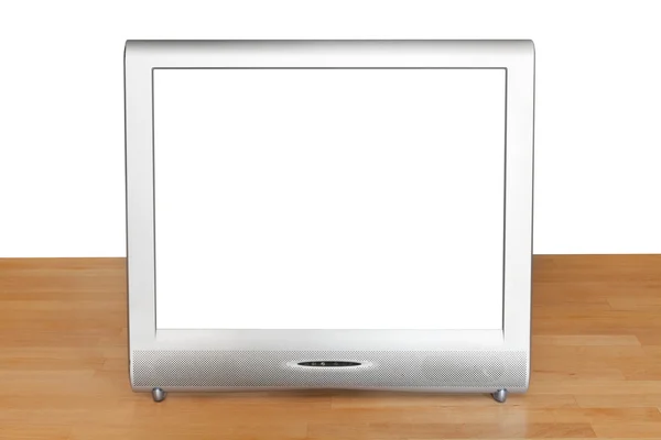 Vista frontal de la pantalla del televisor gris en la mesa — Foto de Stock