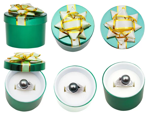 Kleine ronde groene doos met zwarte parel ring — Stockfoto
