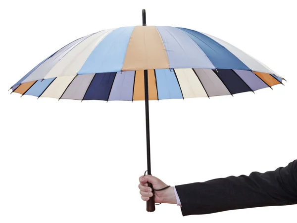 Männerhand mit offenem gestreiften Regenschirm — Stockfoto