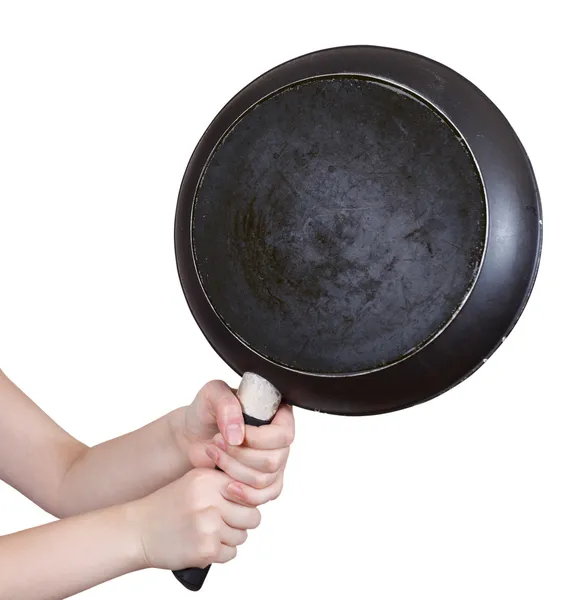 Black skillet in female hands isolated — Stock Photo, Image