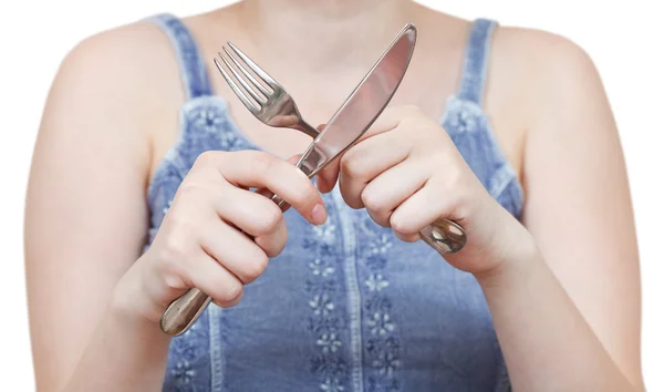 Crossing fork and table knife in hands — Stock Photo, Image
