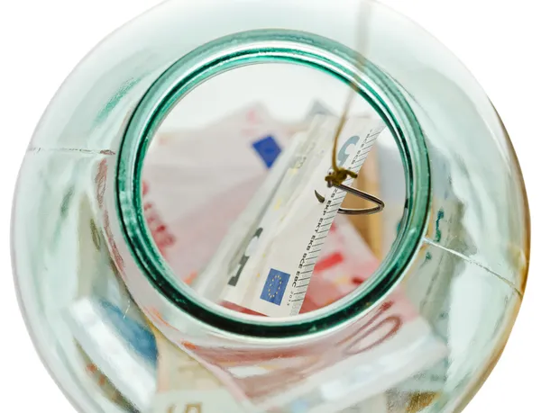 Top view of fishing saving euro money from jar — Stock Photo, Image
