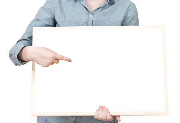 Pointing on blank bulletin board in female hand — Stock Photo, Image