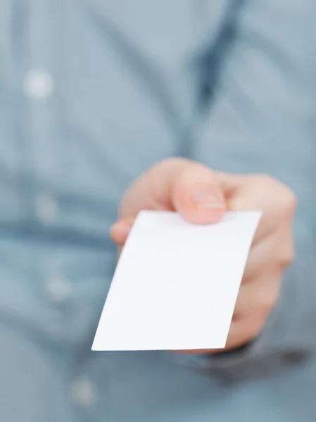 Front view of blank business card in fingers — Stock Photo, Image