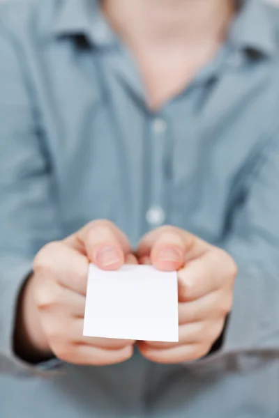 Blank business card in two hands — Stock Photo, Image